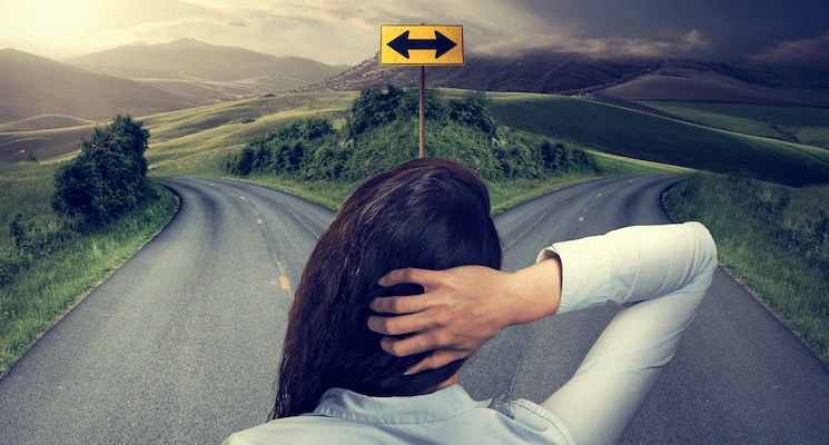 women looking at two different paths