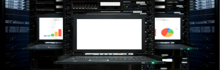 three laptops in a server room