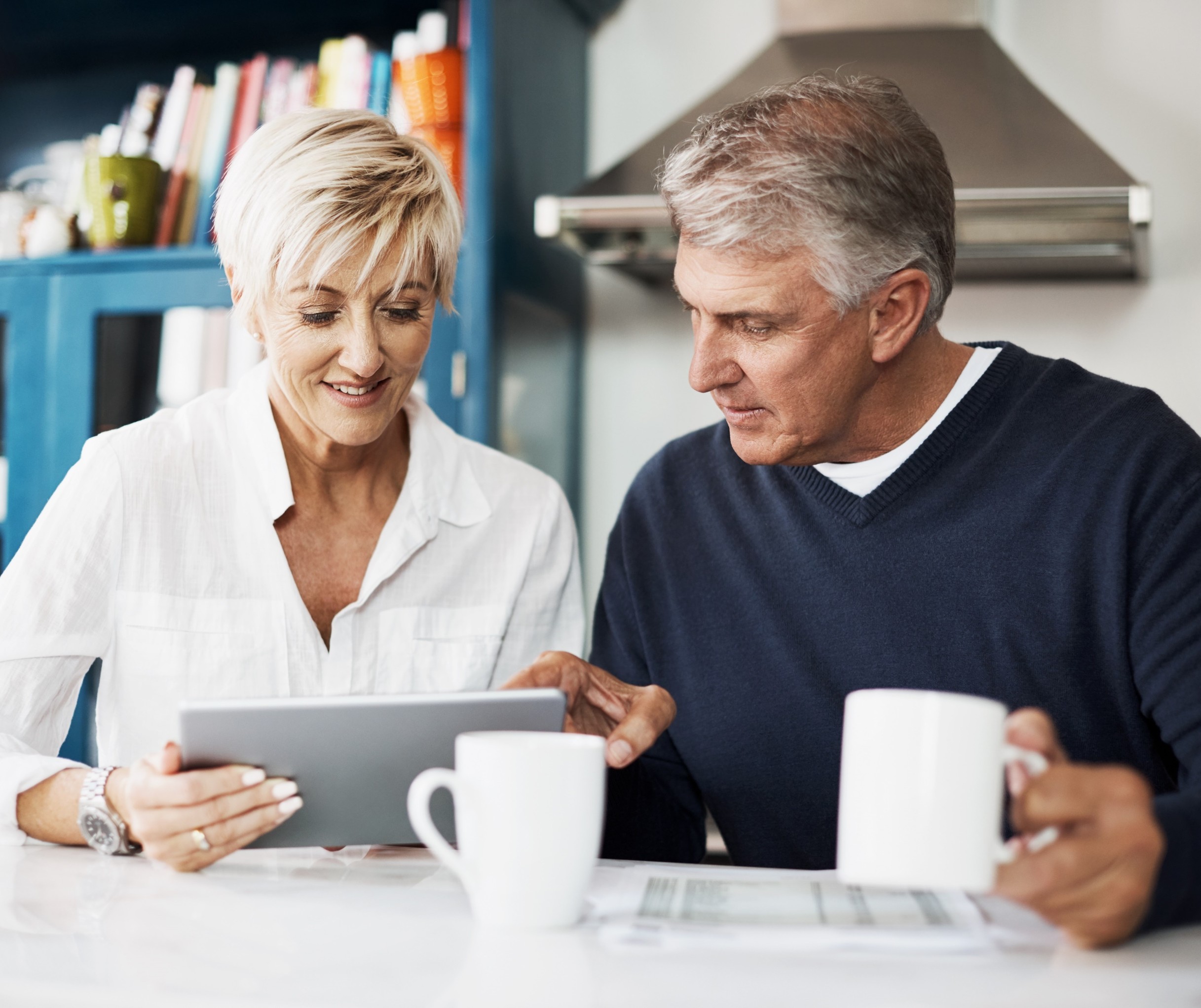 A couple reviewing financial information with a laptop