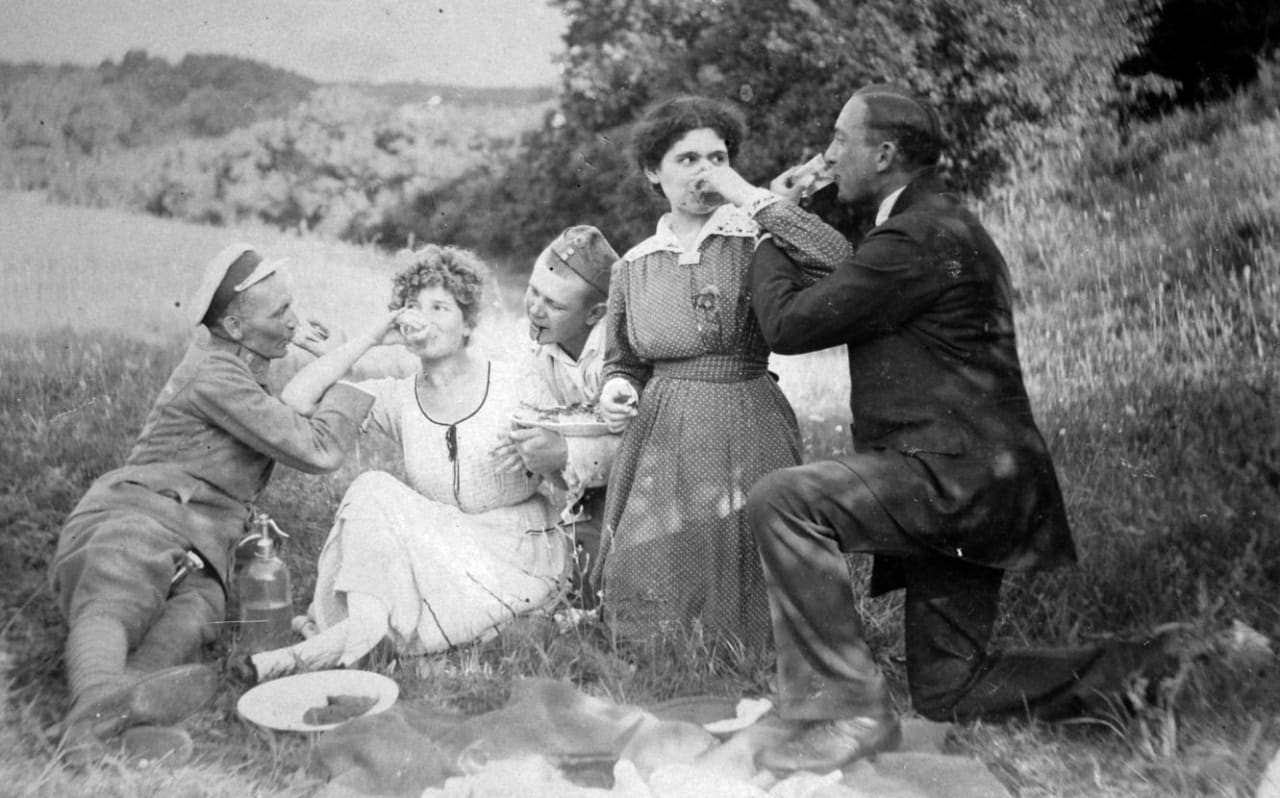 Picnickers drinking Hungarian pálinka