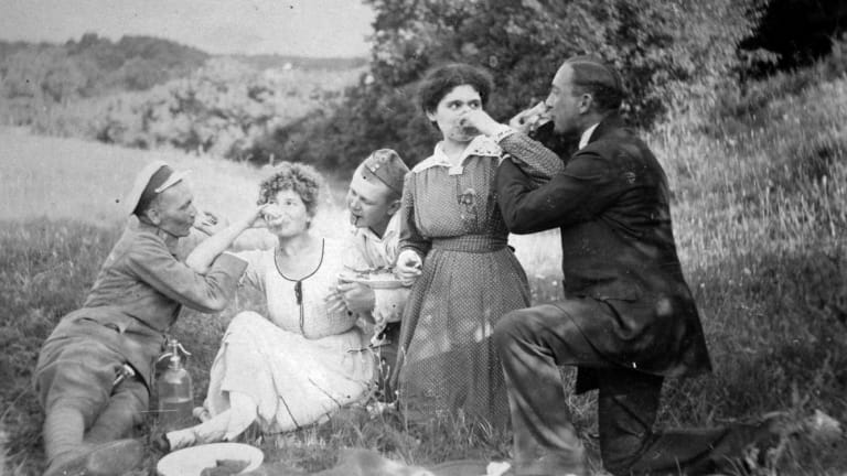 Picnickers drinking Hungarian pálinka