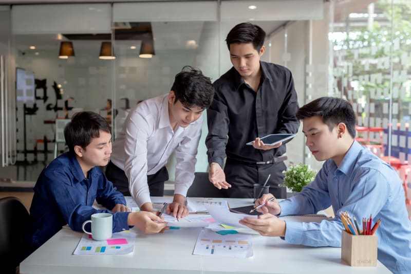 Young professional Asian business men team