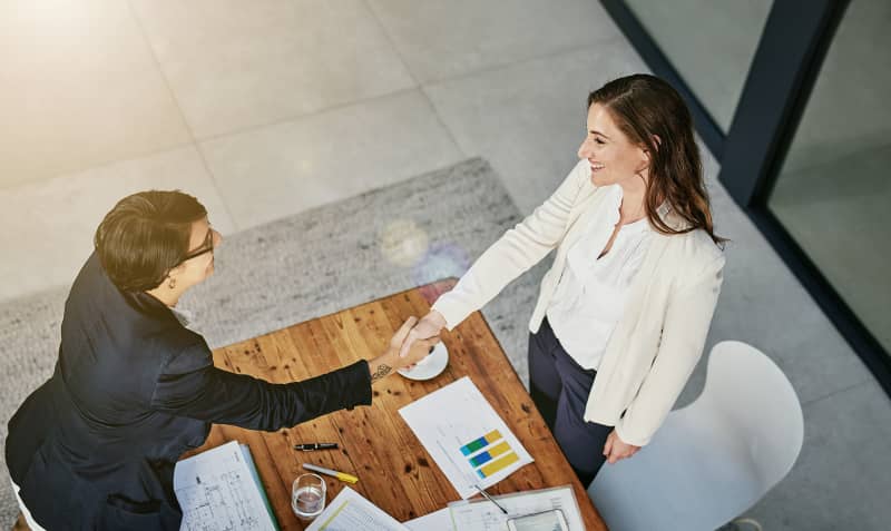 Businesswomen shaking hands