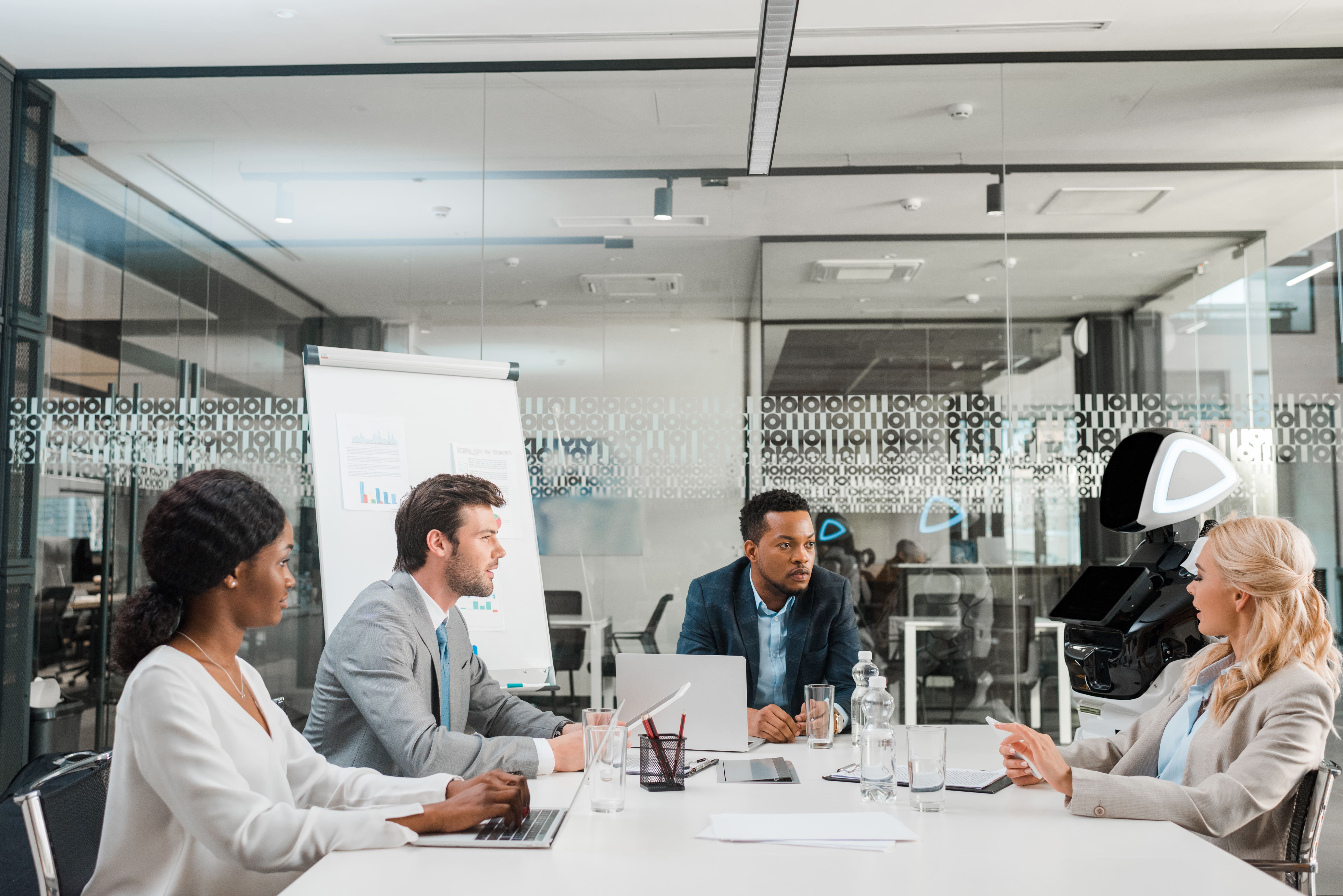 Young multicultural businesspeople at desk