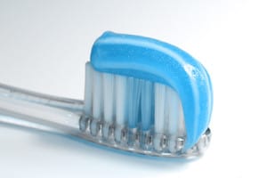Patient smiling with custom dentures