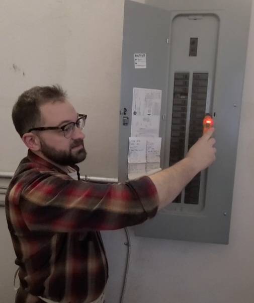 Br. Matthew Demonstrating Electrician Tool Use