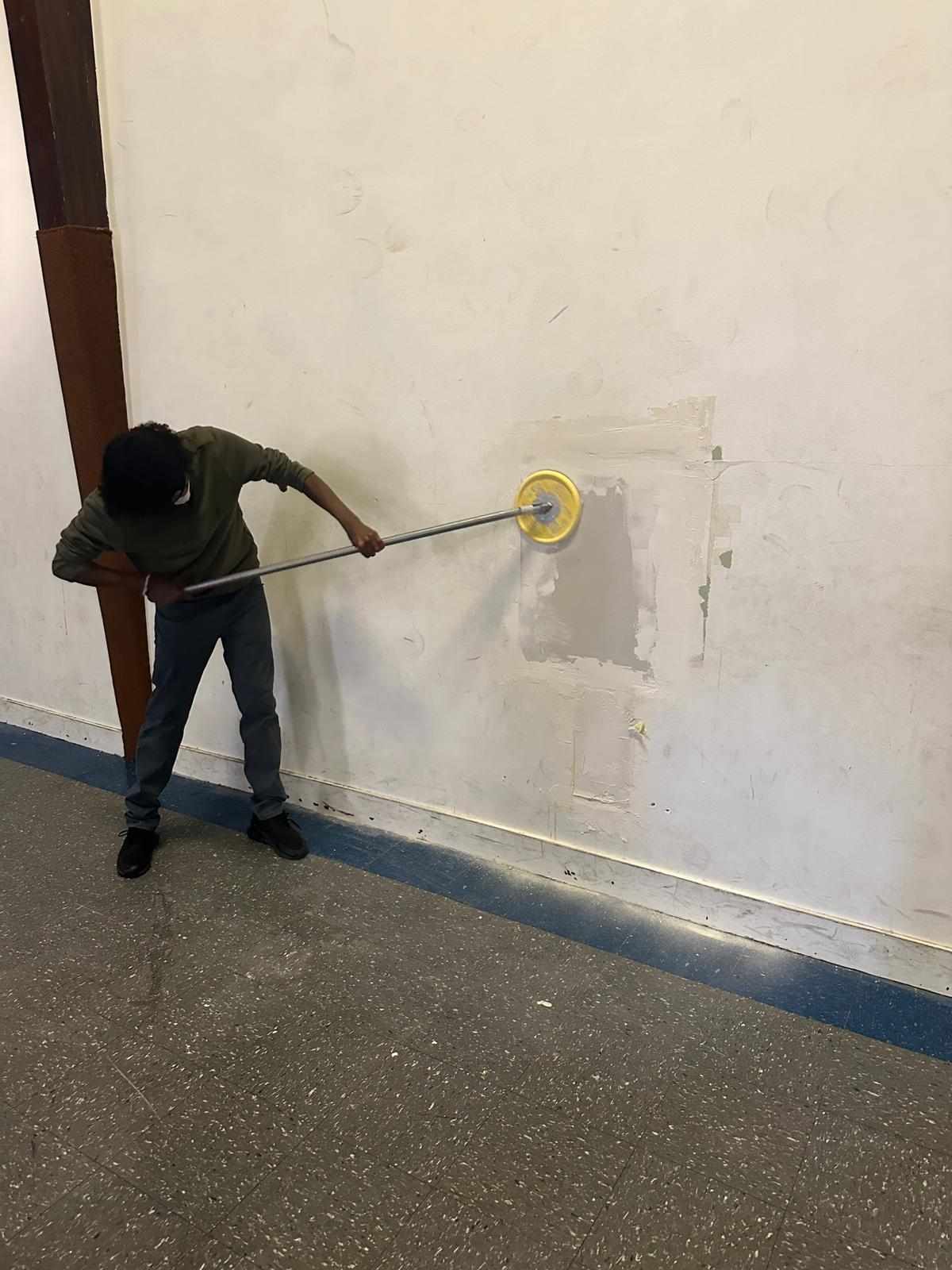 Br. Abdirahman Sanding Drywall Repairs
