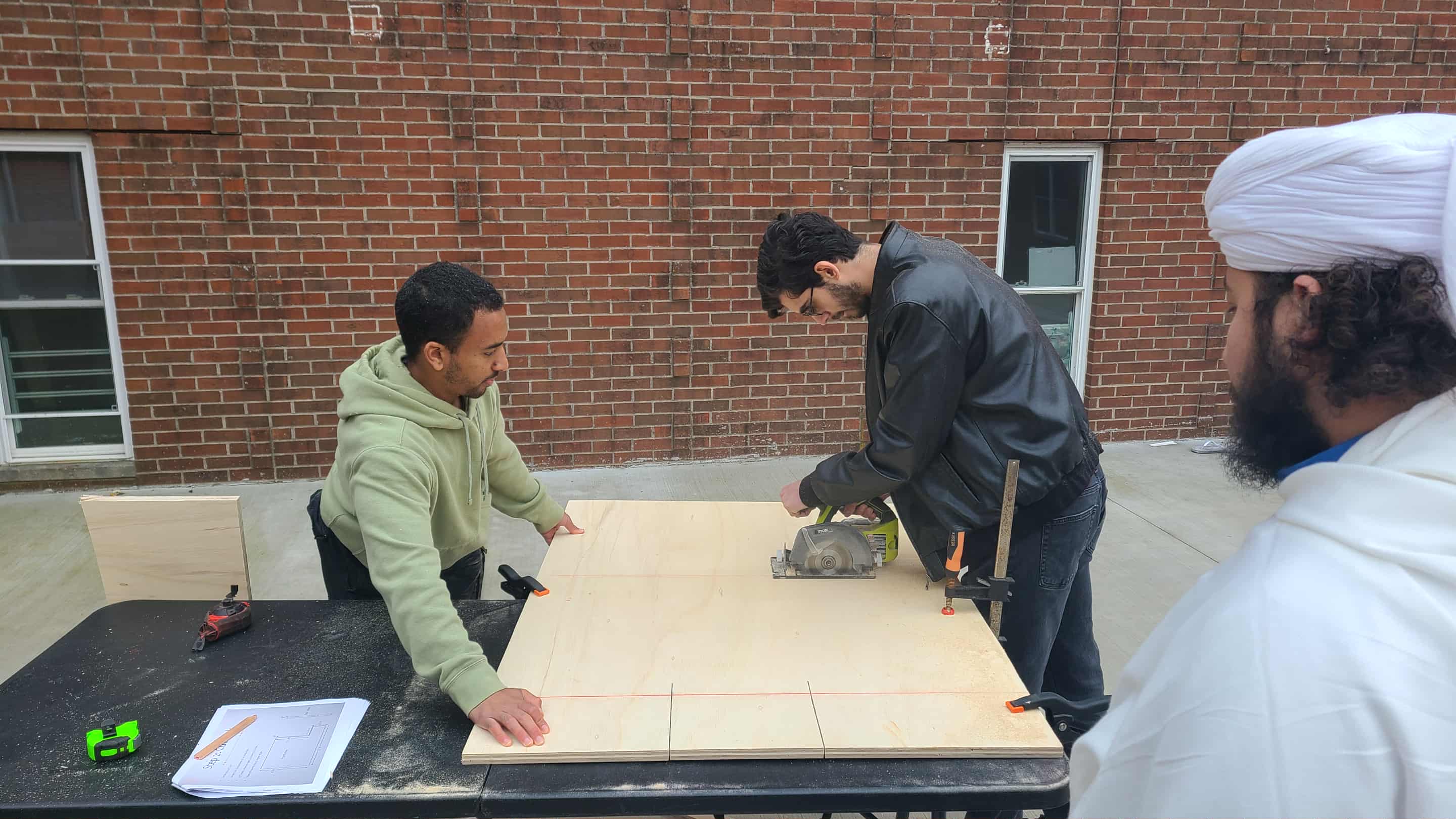 Br Ahmad Haji & Faysal Bulbul Sawing Lumber