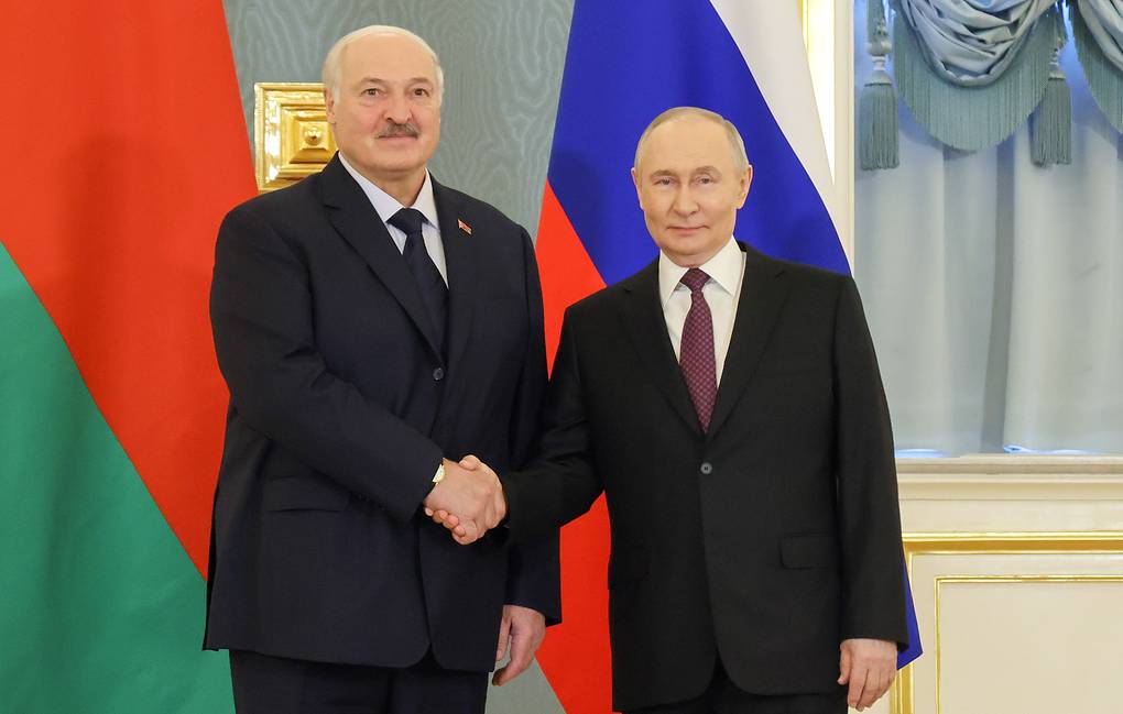 Warm handshake between President Putin and President Lukashenko in Moscow, signaling a deepening Russia-Belarus alliance
