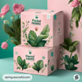 Two pink mailer boxes with botanical designs, featuring green leaves and pink flowers against a pastel backdrop.