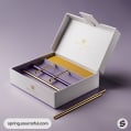 Open white and gold box containing gold metal straws on a purple background.