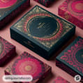 Ornate black and red gift boxes with gold decorative patterns on a pink background.