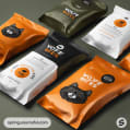 Various pet food bags with orange and black design and dog faces.