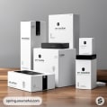 Tall white boxes on a wooden surface with neatly stacked design.