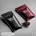 Black and maroon coffee pouches with coffee beans on a grey background.