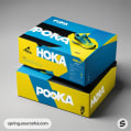 Stacked sneaker boxes with bold color design.