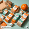 Collection of orange and teal packages with dog graphics, an orange fruit nearby.