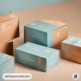 Pastel blue and orange boxes arranged artistically on a light brown surface.