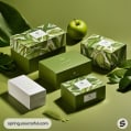 Green nature-themed packaging set with leaf patterns and an apple, includes various sized boxes against a green backdrop.