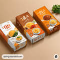 Three noodle packages with distinctive designs showcasing noodle dishes.