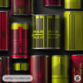 Red and green metal cans with geometric patterns on a black background.