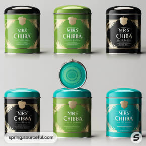 Round tins in green and black with gold leaf motifs.