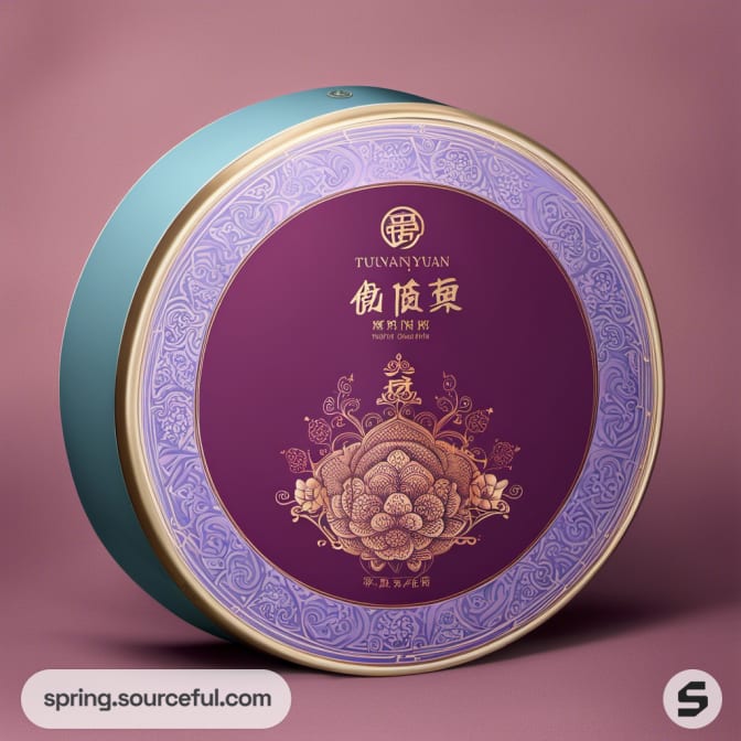 Round purple and gold tea tin with floral design against a mauve background.