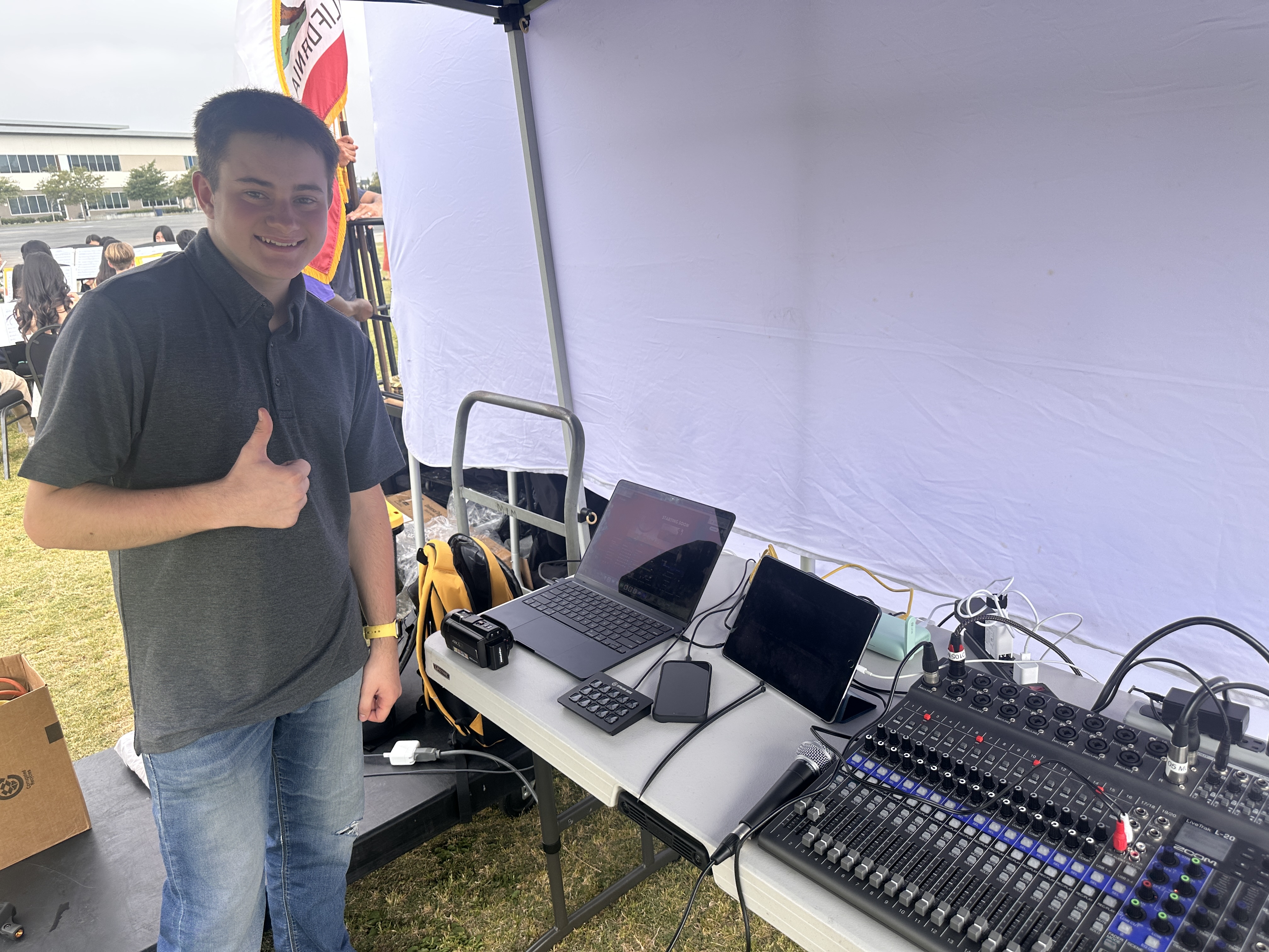 Mason Thumbs Up Behind the Stage