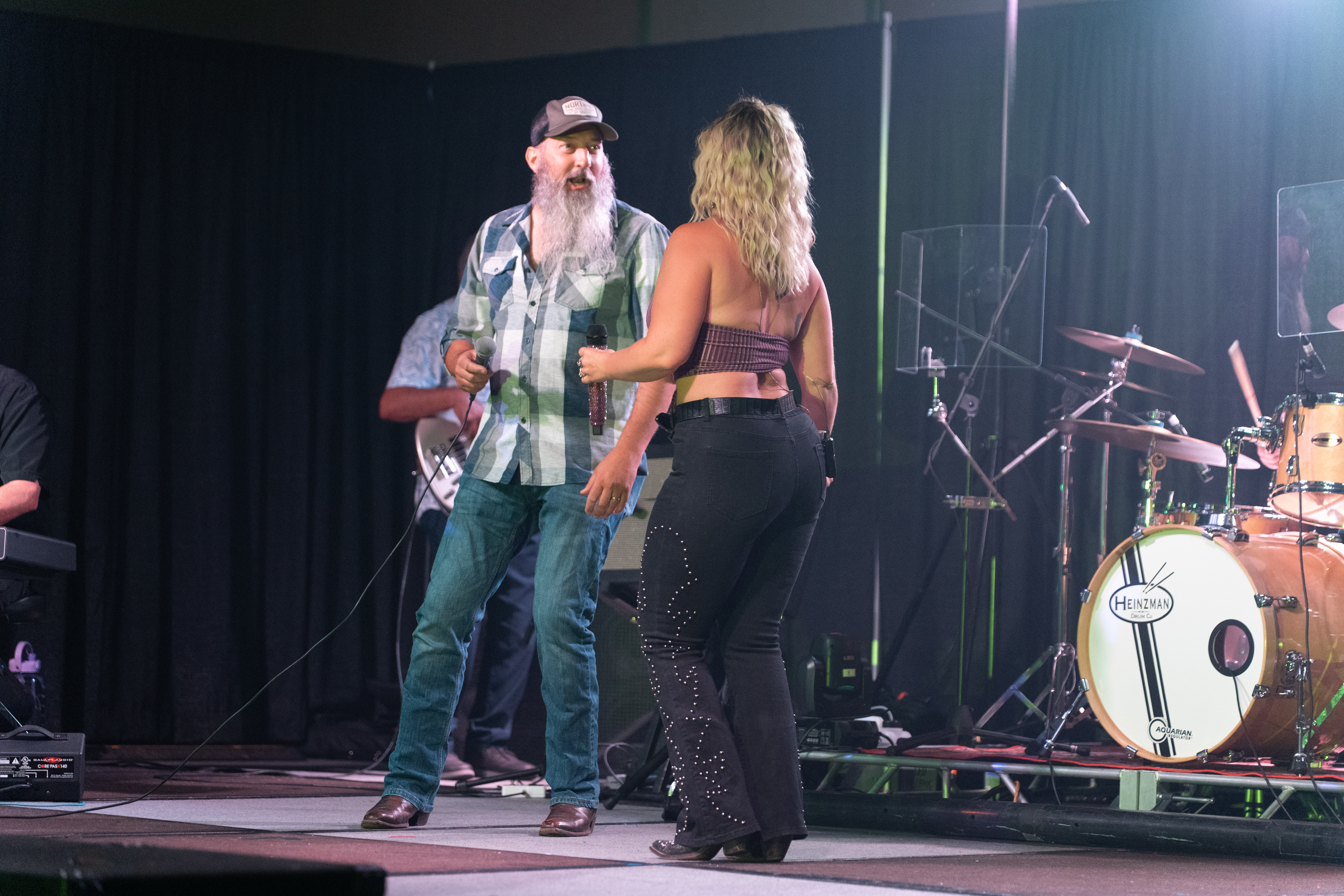 Leah Justine and Jonathan Harris performing together onstage
