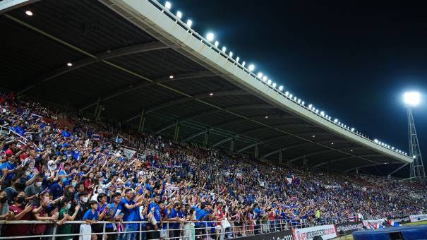 A full stadium at the Mitsubishi Electric Cup 2022. Fans cheering.