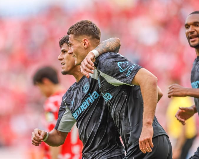 Two Bayer Leverkusen player celebrating