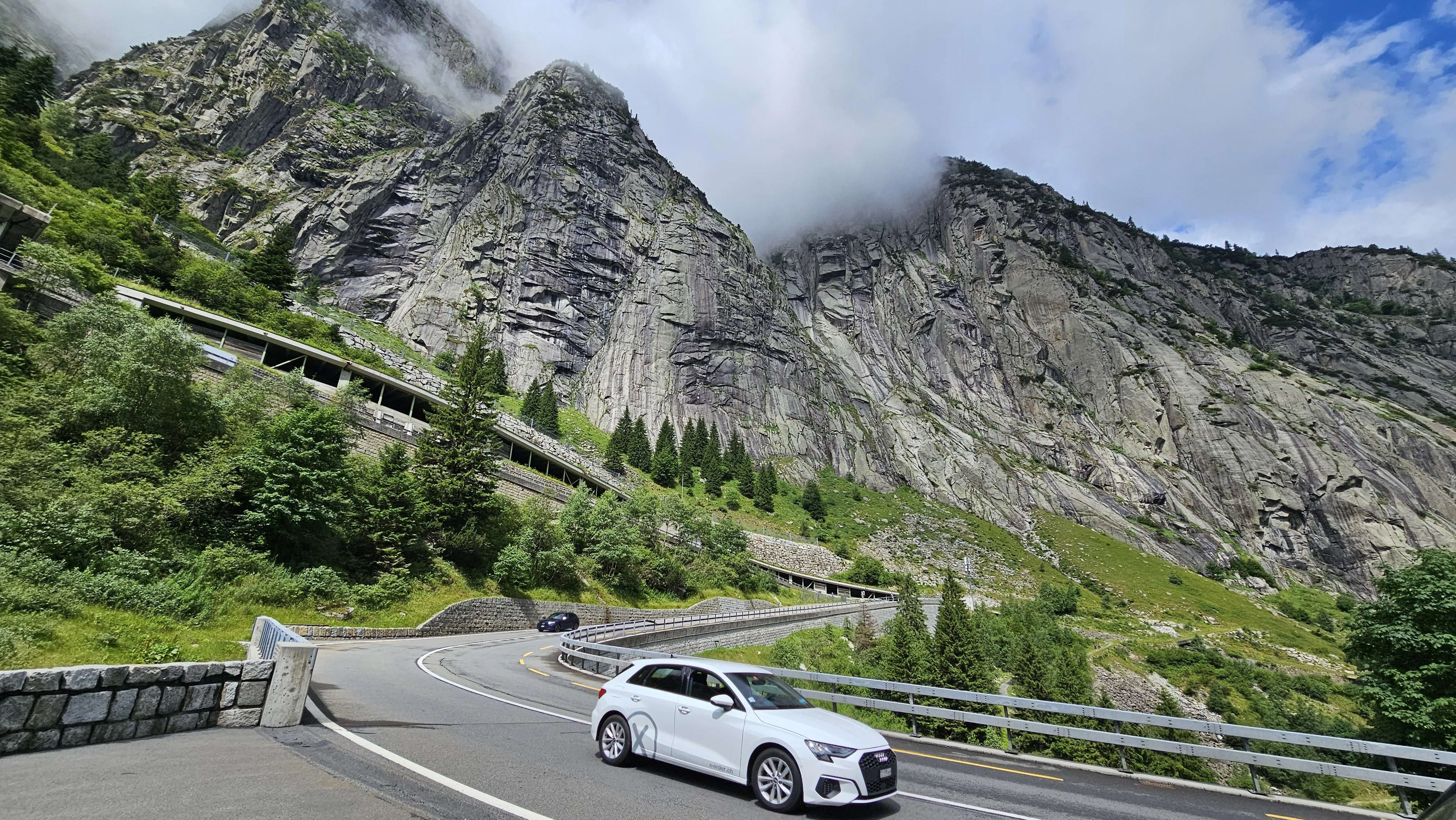 Alpine switchback roads ascending from Italy into Switzerland