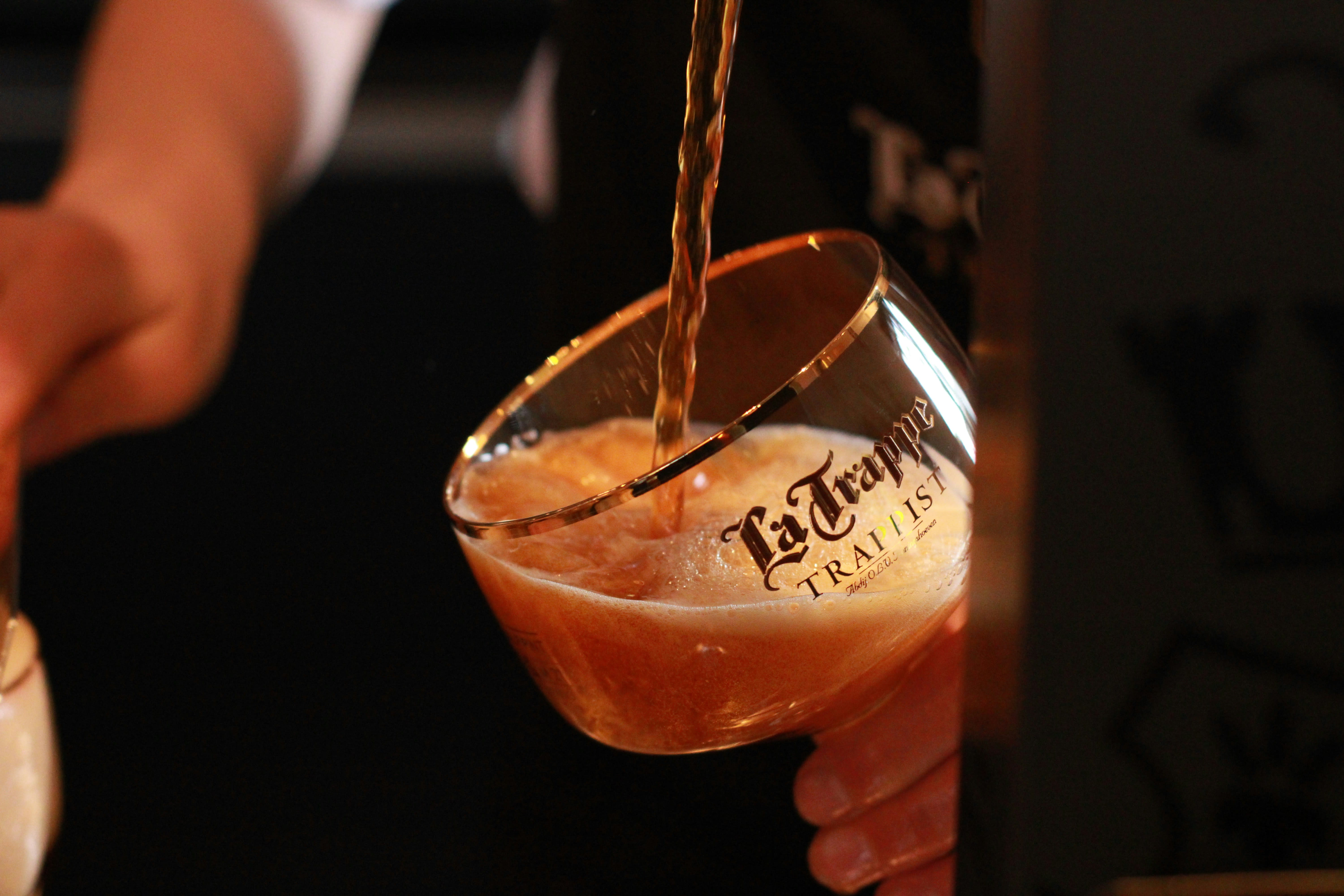 Beer being poured into a La Trappe Trappist glass at the tap