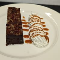 Bourbon Pecan Brownie with vanilla ice cream and salted caramel sauce