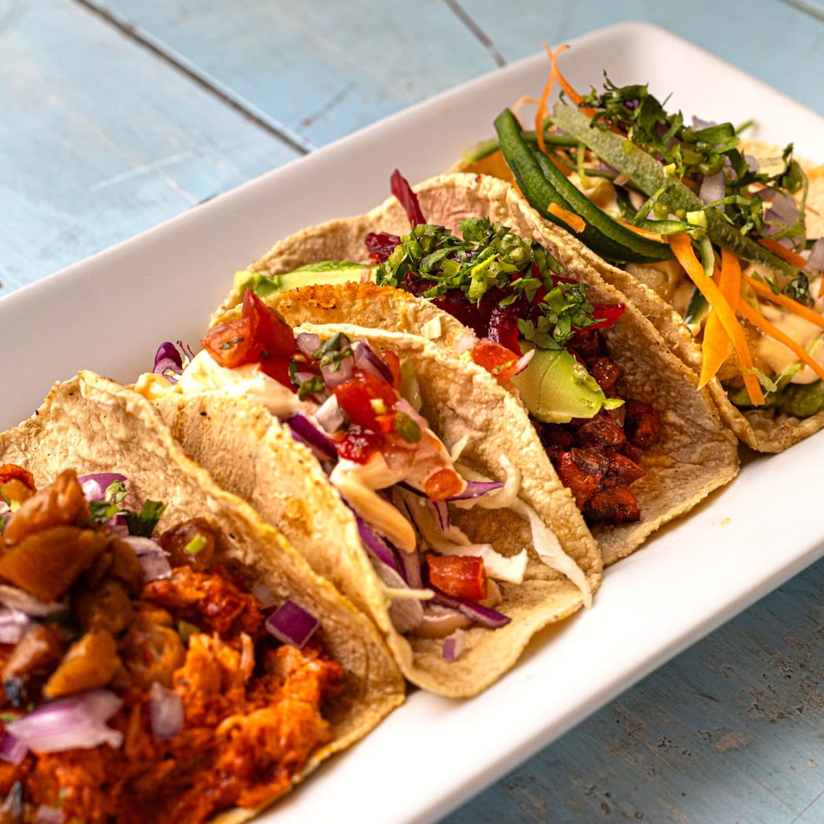 Authentic Mexican tacos platter — street food dining cost of living Puerto Escondido