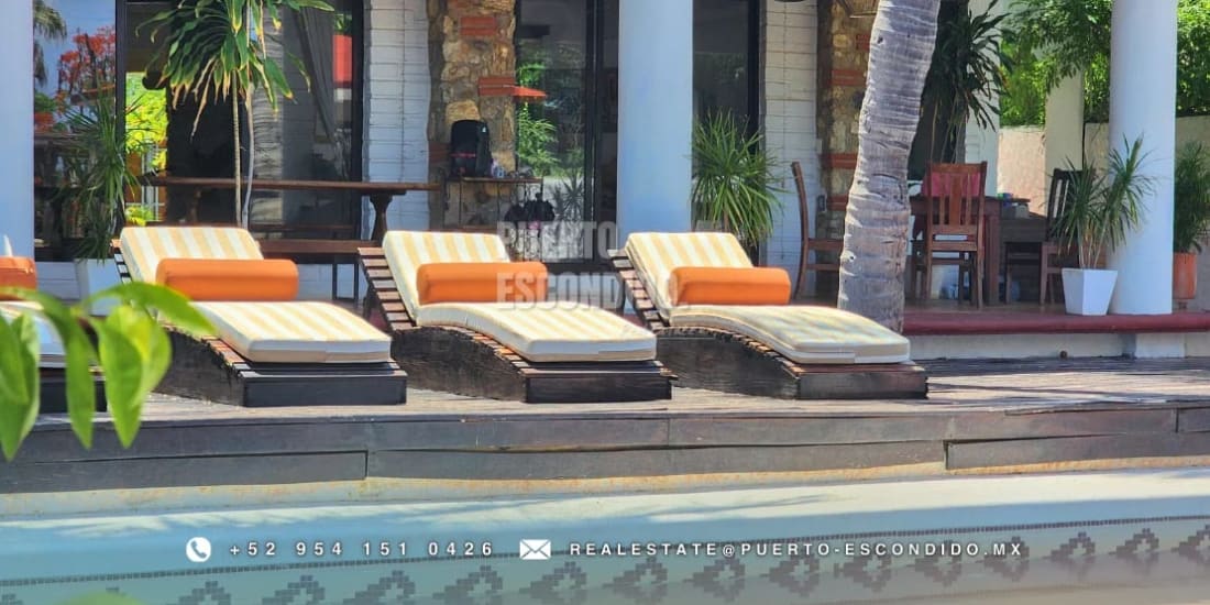 Casa Bonita pool area with tropical garden landscaping in La Punta Puerto Escondido