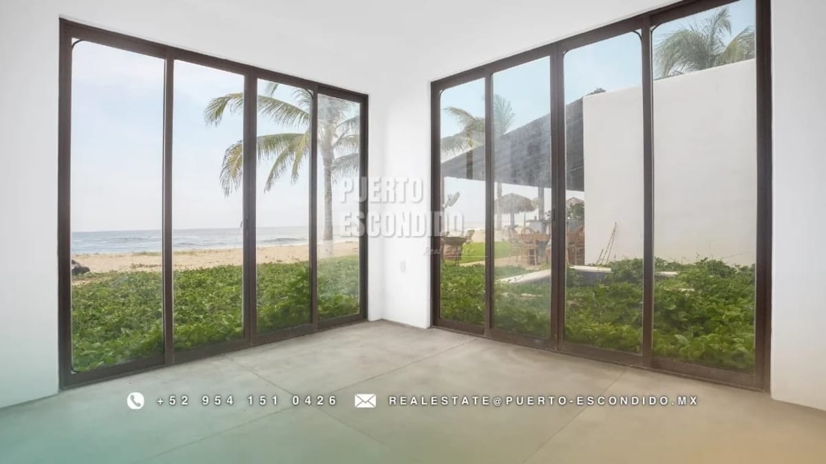 Beachfront residence in Palmarito, Puerto Escondido, with direct sand access and private pool, listed at 503360 USD as an example of luxury property Puerto Escondido 500000 budget