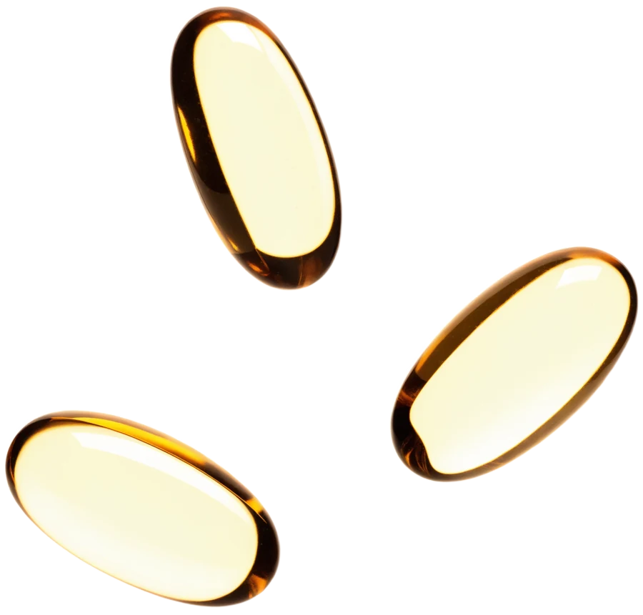 Tres softgels de gelatina ámbar, sellados en una sola pieza, con aceite dentro