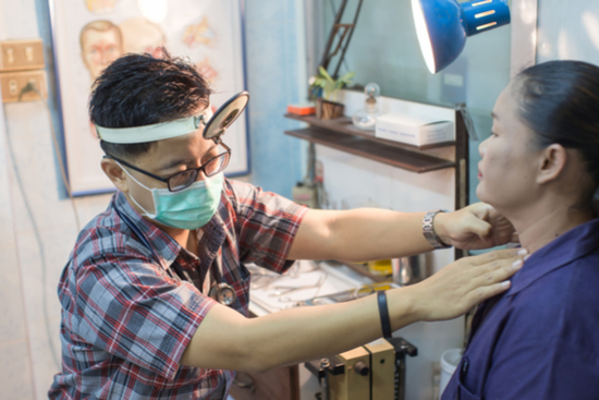 a doctor checking a patient in his clinic