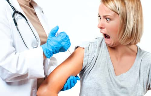 Woman getting poked by needle