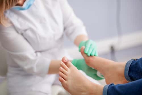 Doctor examining feet 