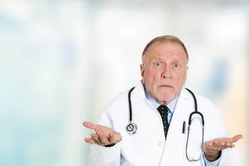 Doctor shrugging because he does not know what is going on