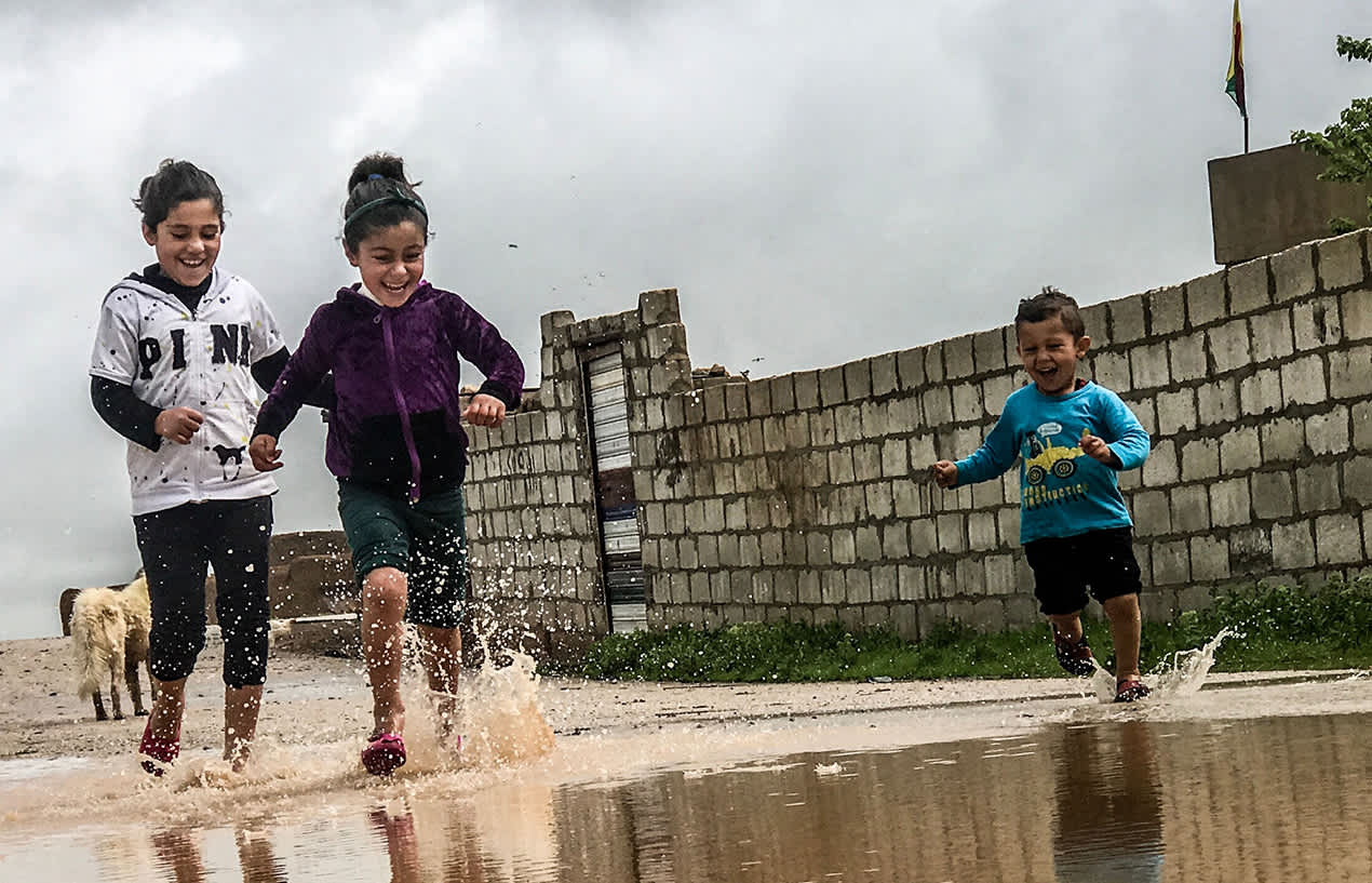 kids running in puddles