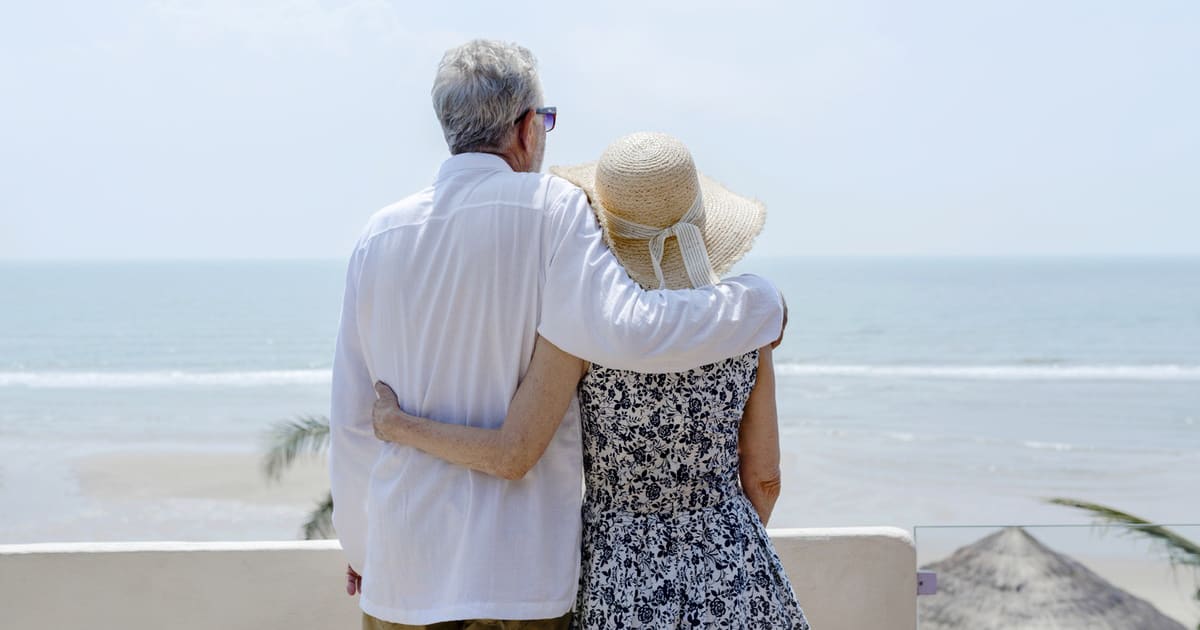 elderly couple by the sea