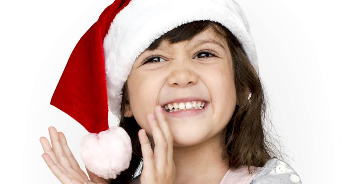 smiling girl in a santa hat