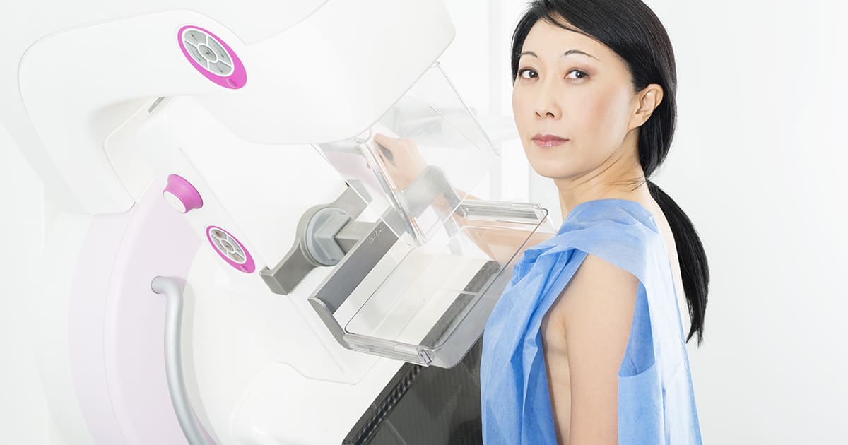 a woman having a breast scan