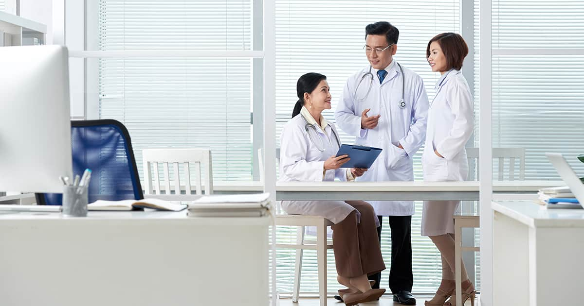 asian doctors talking in an office