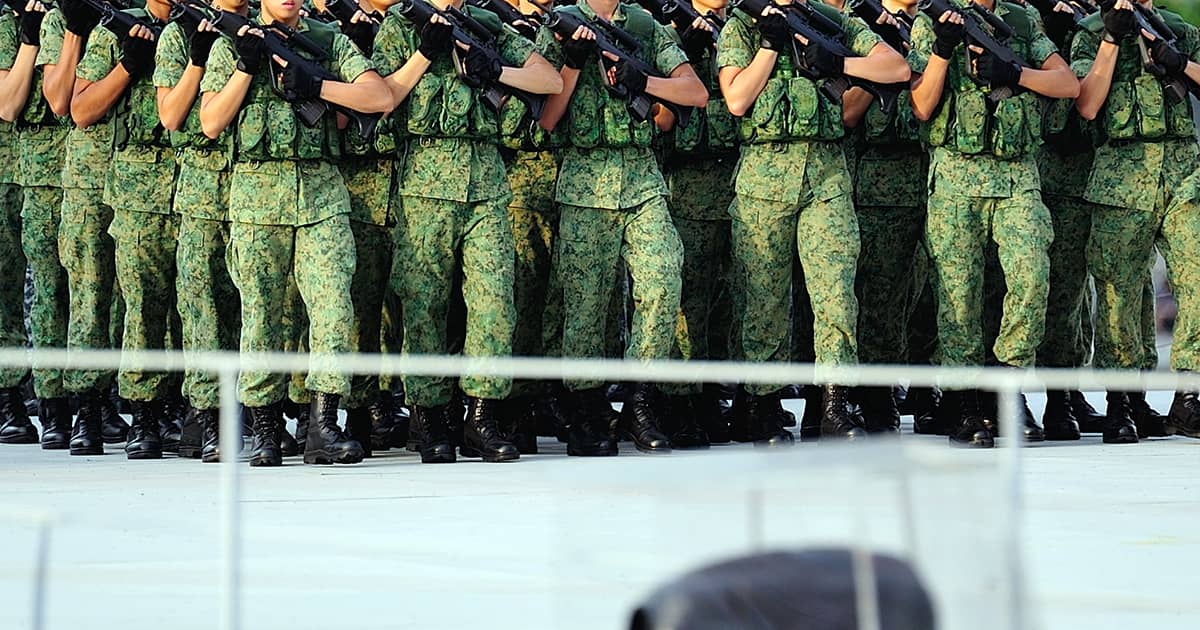 ns men in singapore marching