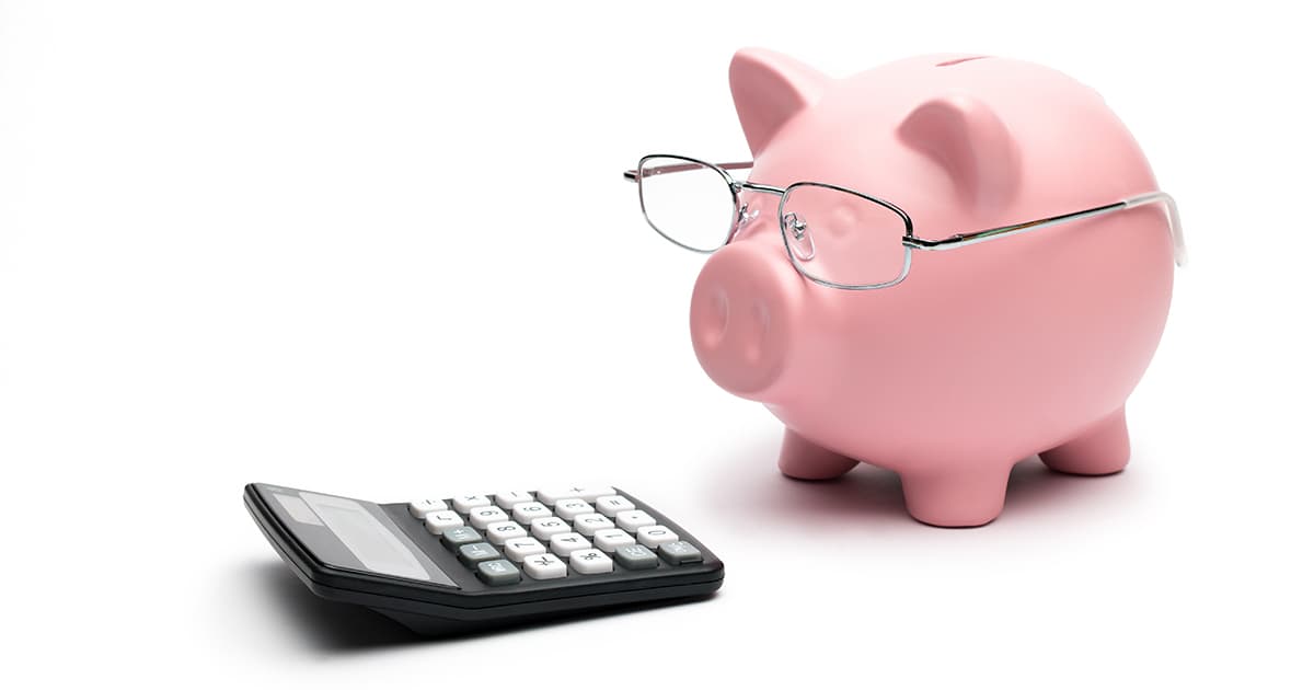 piggy bank with glasses and calculator