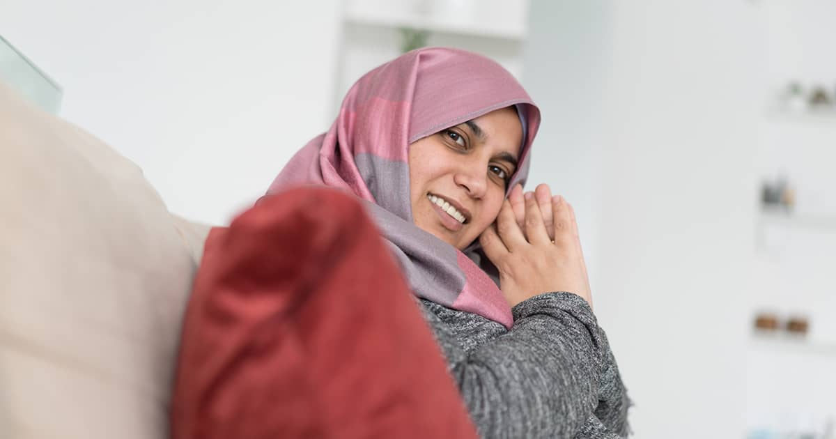 muslim woman smiling at camera